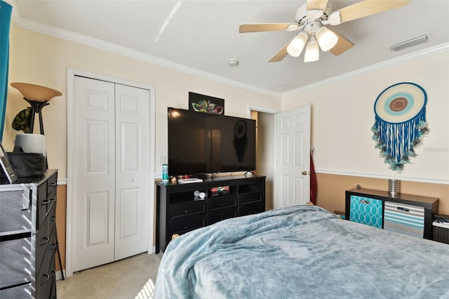 bedroom featuring light carpet, visible vents, a closet, and ornamental molding