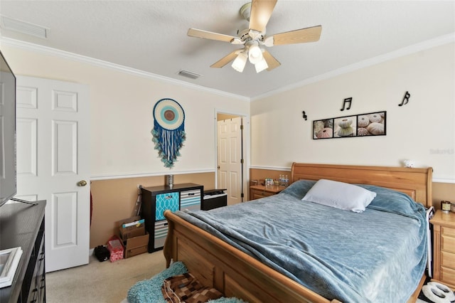 bedroom with ornamental molding, light colored carpet, visible vents, and a ceiling fan