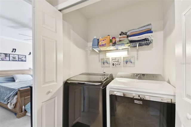 laundry room with laundry area and washer and clothes dryer