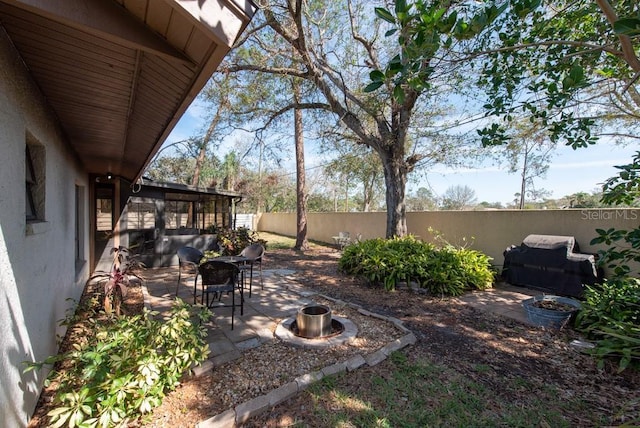 view of yard with a fenced backyard and a patio