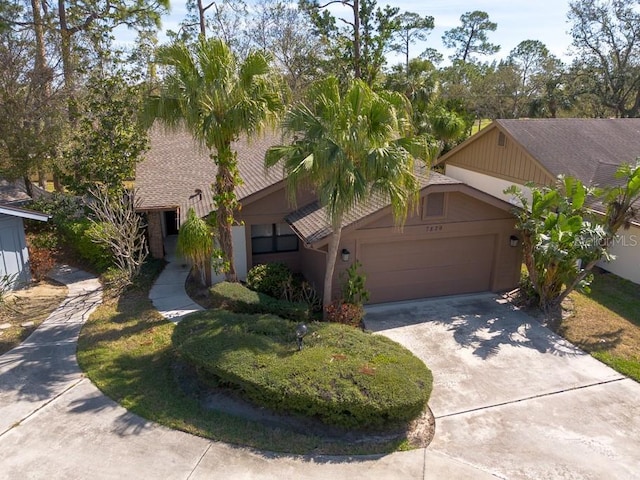 view of front of home with driveway and an attached garage