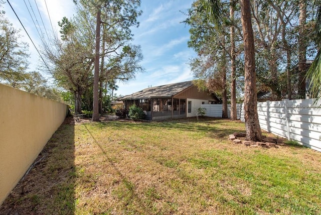 view of yard with a fenced backyard