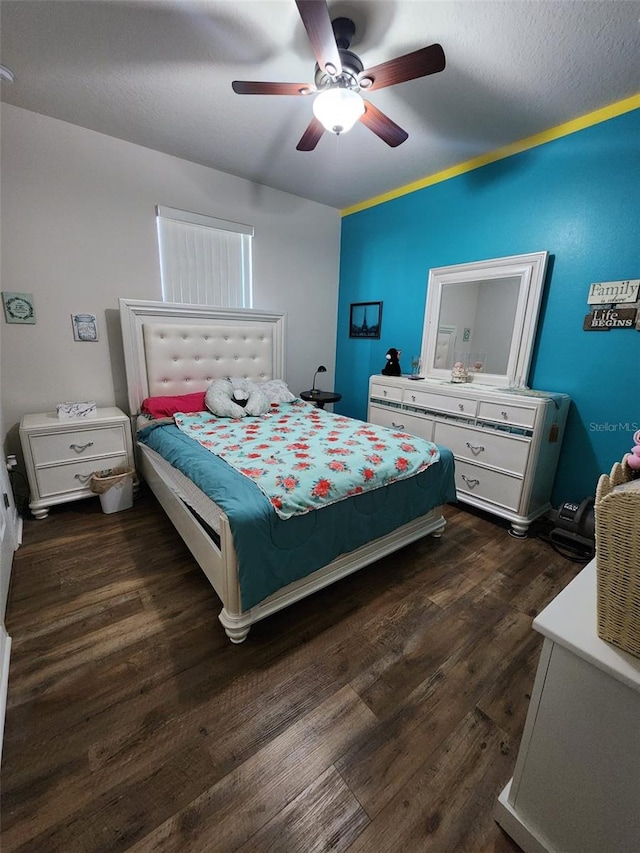 bedroom with dark wood-style floors and ceiling fan