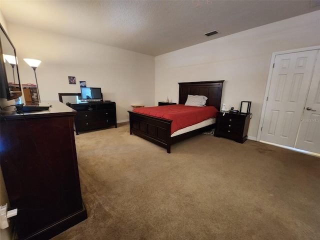 bedroom featuring baseboards, visible vents, a textured ceiling, and light colored carpet