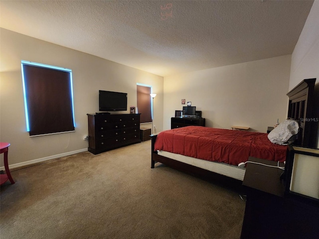 carpeted bedroom with baseboards and a textured ceiling