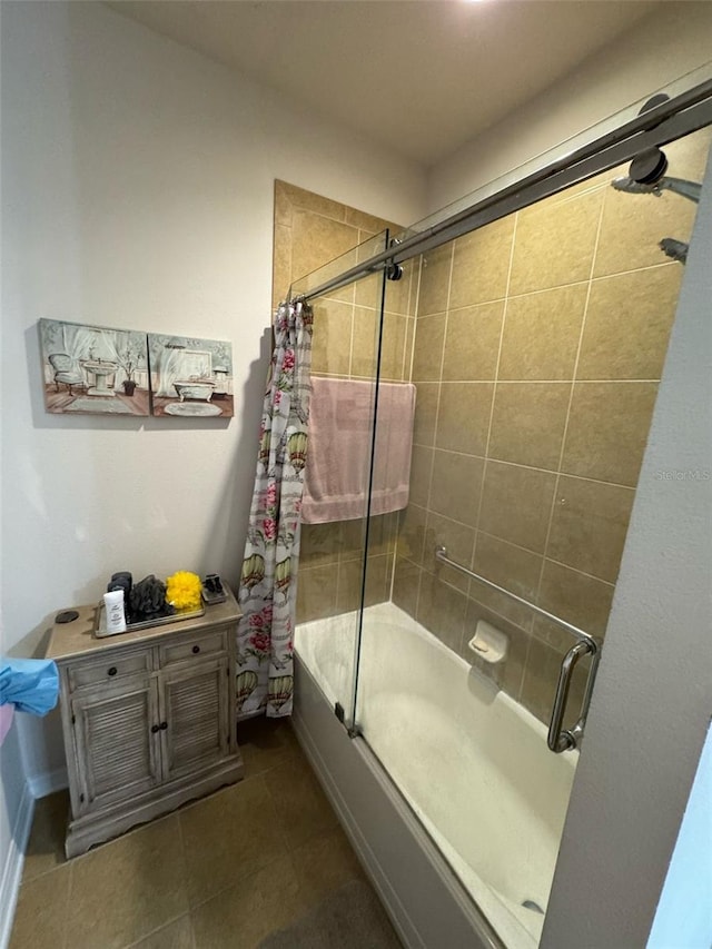 bathroom featuring combined bath / shower with glass door and tile patterned flooring