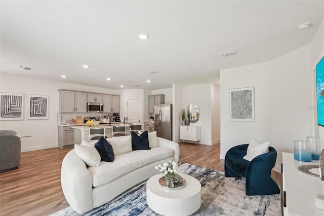 4754 Easter Ter, North Port, FL 34286 - living area featuring baseboards, visible vents, light wood-style floors, and recessed lighting