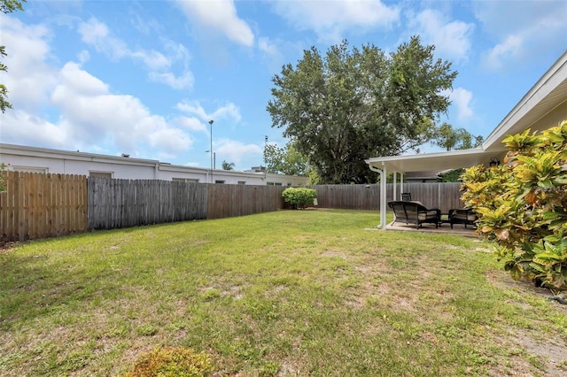 view of yard featuring a fenced backyard and a patio