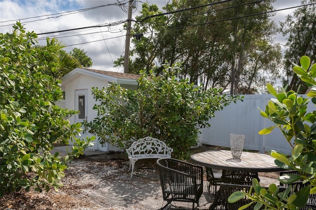 view of patio / terrace featuring fence