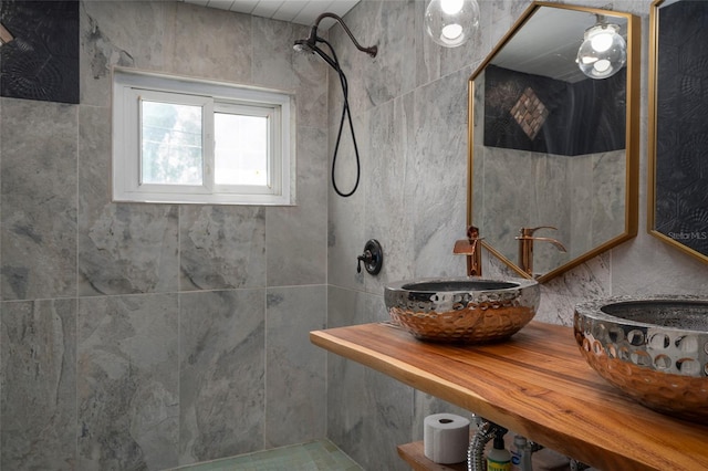 full bathroom with tiled shower