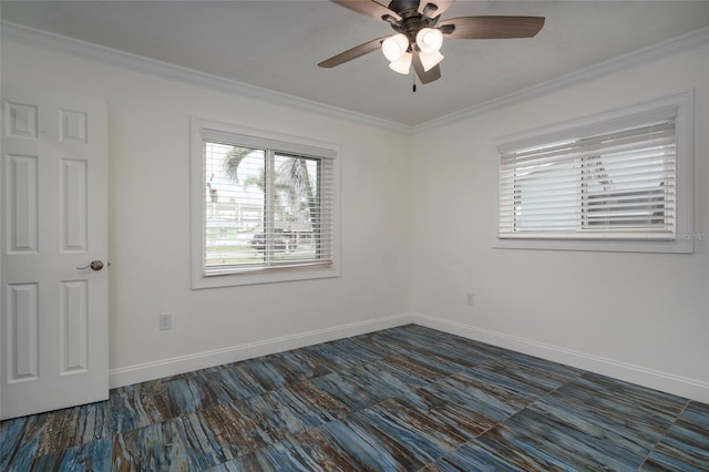 spare room featuring ornamental molding, a ceiling fan, and baseboards