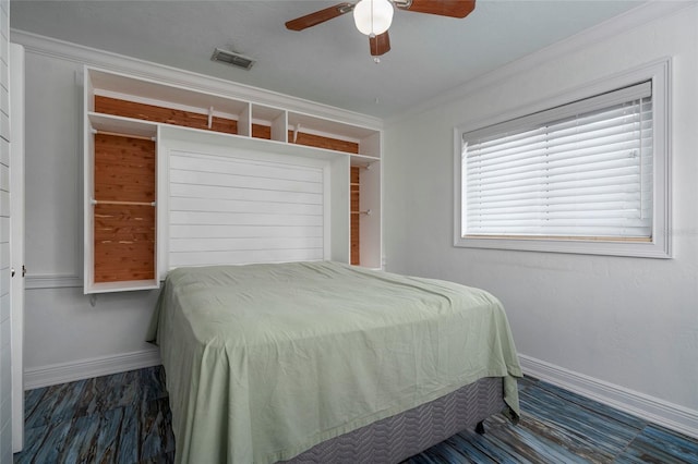 bedroom featuring baseboards, visible vents, ceiling fan, and crown molding