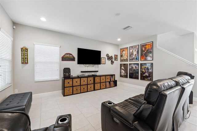 living room with recessed lighting, visible vents, and light tile patterned floors