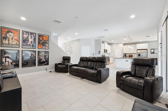 living room with recessed lighting, visible vents, and light tile patterned floors