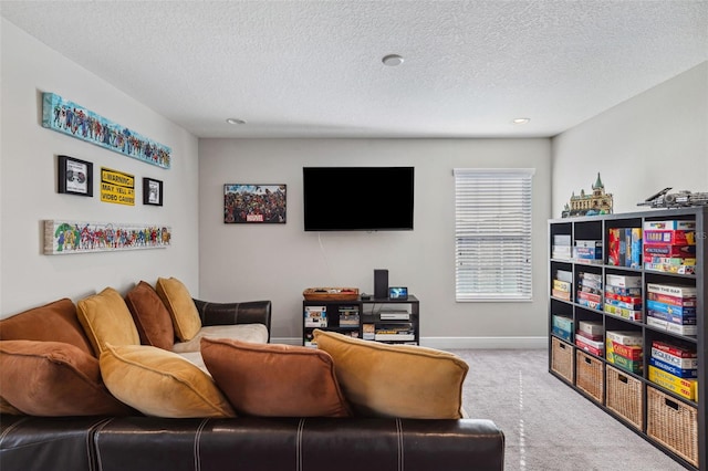 carpeted living room with a textured ceiling and baseboards