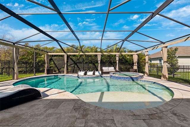 view of swimming pool with glass enclosure, a pool with connected hot tub, fence, and a patio