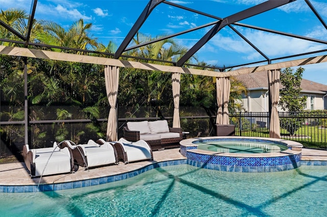 view of pool featuring a patio area, glass enclosure, outdoor lounge area, and a pool with connected hot tub