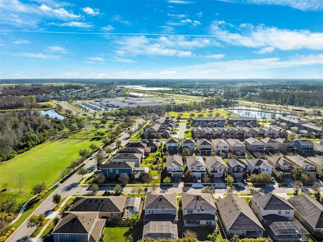 aerial view featuring a water view and a residential view