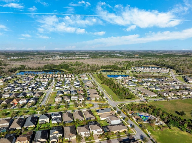 bird's eye view with a residential view and a water view