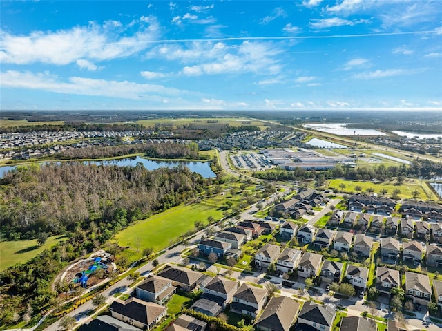 birds eye view of property featuring a water view and a residential view