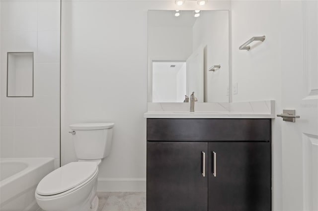 bathroom featuring toilet, baseboards, a bathtub, and vanity