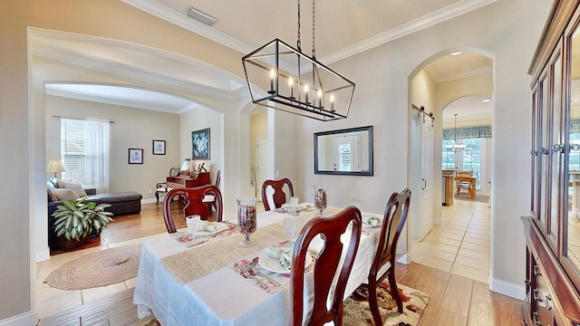 dining space with ornamental molding, arched walkways, visible vents, and light wood finished floors