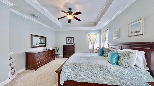 bedroom featuring a tray ceiling, crown molding, light colored carpet, visible vents, and baseboards