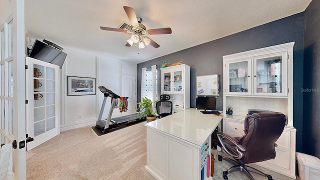 office space with ceiling fan and light colored carpet