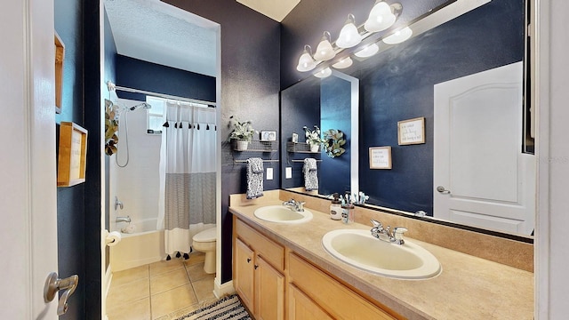 full bathroom featuring a textured ceiling, shower / tub combo, a sink, and tile patterned floors