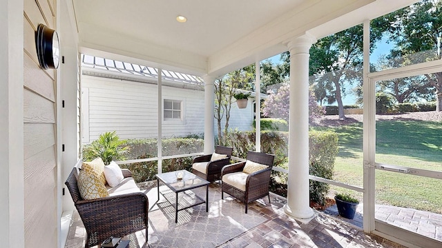 sunroom featuring decorative columns