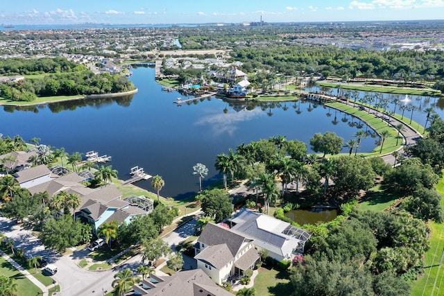 drone / aerial view featuring a water view and a residential view