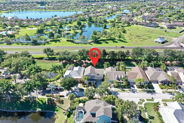 bird's eye view with a water view and a residential view