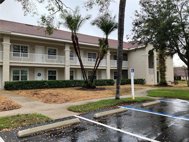 view of property featuring uncovered parking