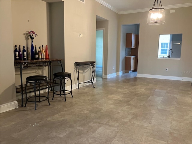 dining area featuring ornamental molding and baseboards