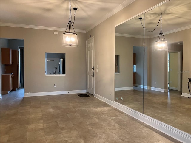 interior space featuring crown molding and baseboards