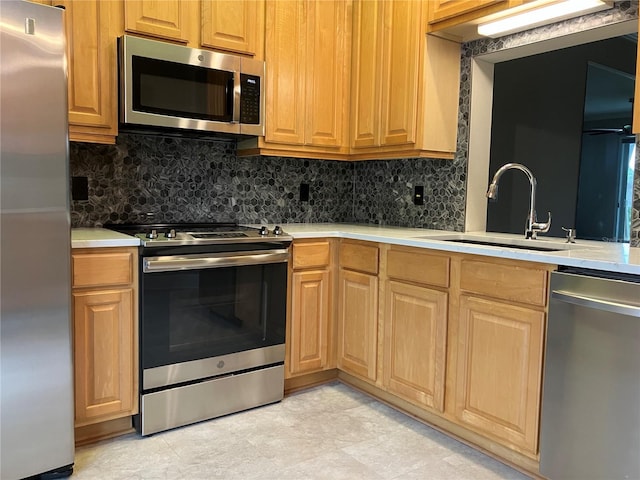 6815 Dali Ave Unit F101, Land O Lakes, FL 34637 - kitchen featuring stainless steel appliances, tasteful backsplash, and light countertops