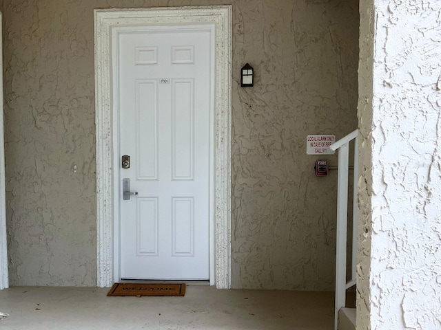 6815 Dali Ave Unit F101, Land O Lakes, FL 34637 - view of exterior entry featuring stucco siding