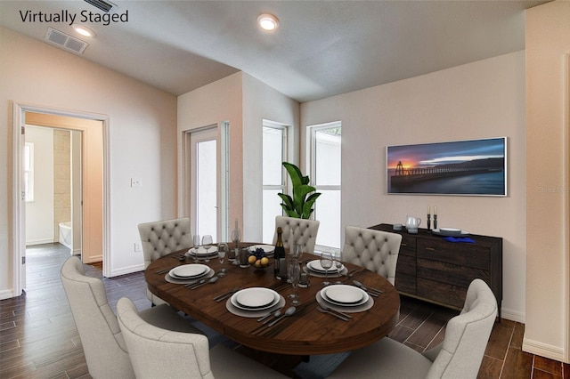 dining space with baseboards, visible vents, vaulted ceiling, wood finish floors, and recessed lighting