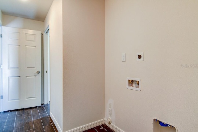 clothes washing area featuring wood finish floors, hookup for a washing machine, electric dryer hookup, laundry area, and baseboards