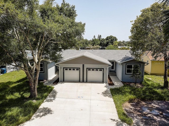 ranch-style house featuring a garage, concrete driveway, a front lawn, and stucco siding