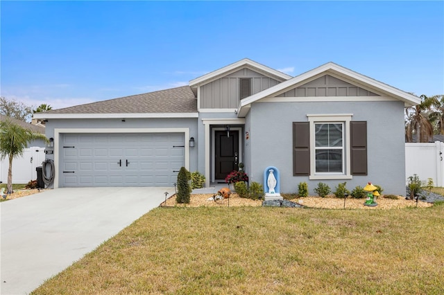 ranch-style home featuring a garage, concrete driveway, board and batten siding, and a front yard