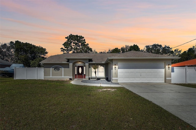 ranch-style home featuring a front yard, fence, and stucco siding