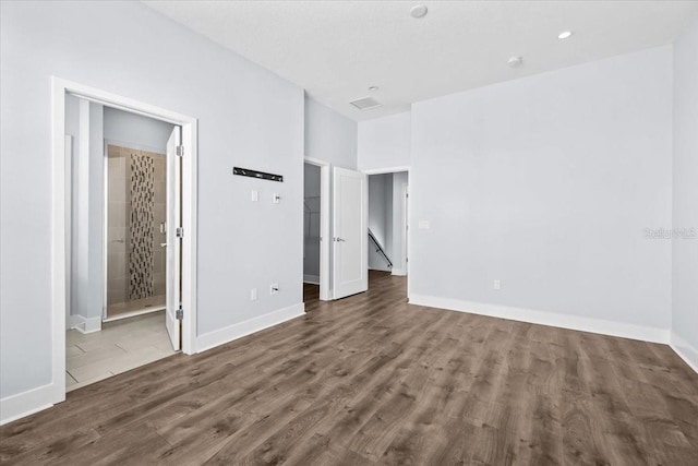 interior space featuring baseboards and wood finished floors