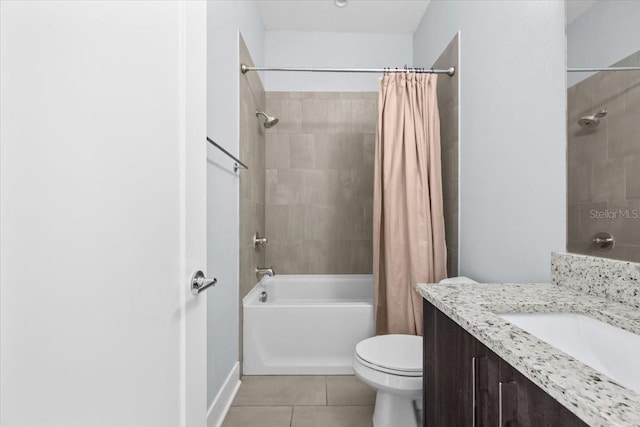 bathroom with shower / bath combo, tile patterned flooring, vanity, and toilet