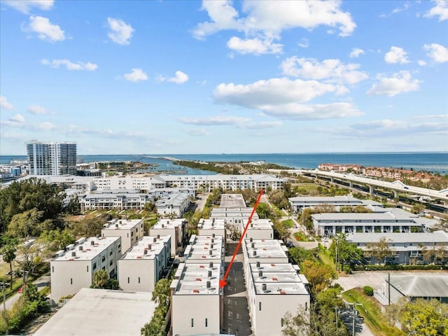 bird's eye view featuring a water view and a city view