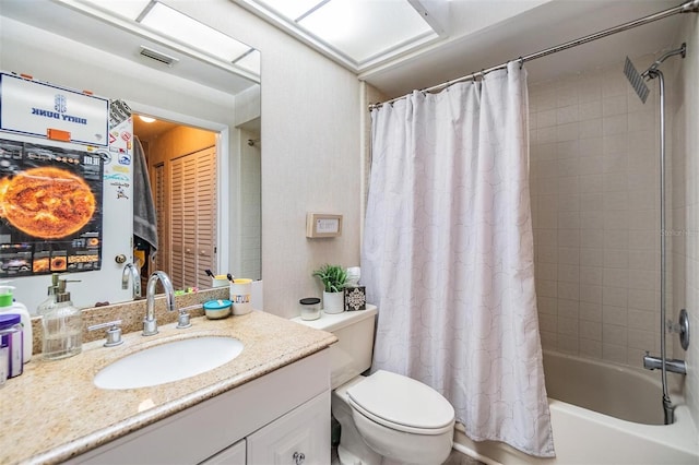 full bath featuring visible vents, shower / tub combo with curtain, vanity, and toilet