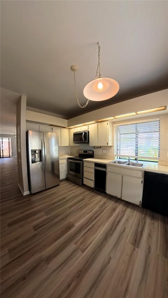 1822 Lake Cypress Dr Unit 1822, Safety Harbor, FL 34695 - kitchen with light countertops, dark wood finished floors, appliances with stainless steel finishes, and a sink