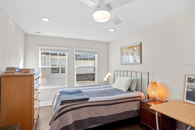 bedroom featuring recessed lighting, wood finished floors, a ceiling fan, and baseboards