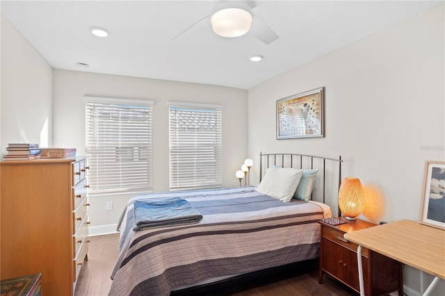 bedroom featuring ceiling fan, baseboards, wood finished floors, and recessed lighting