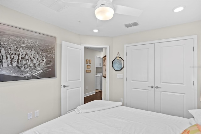 bedroom with recessed lighting, visible vents, a ceiling fan, a closet, and washer / dryer